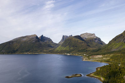 Scenic view of lake and mountains against sky