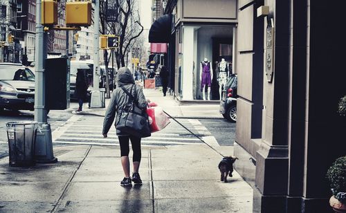 Full length of woman walking in city