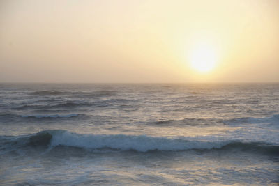 Scenic view of sea against clear sky during sunset