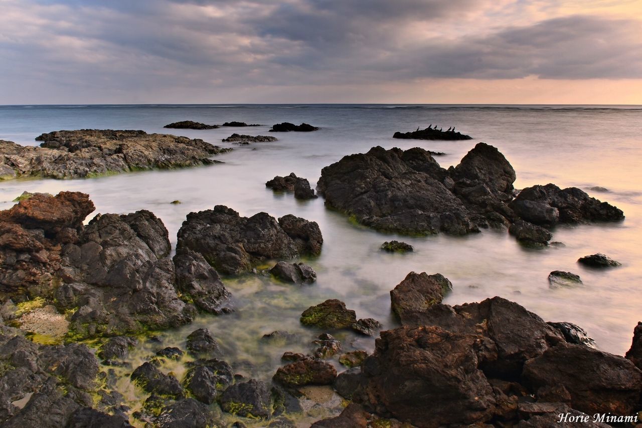 sea, horizon over water, sky, rock - object, water, nature, sunset, scenics, beauty in nature, tranquility, rock, tranquil scene, no people, cloud - sky, outdoors, beach, day