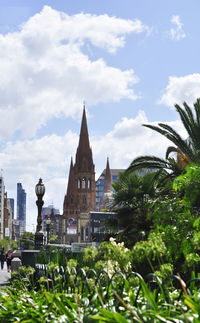 View of trees and buildings against sky
