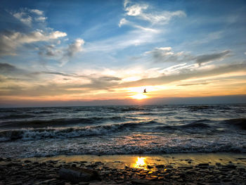 Scenic view of sea against sky during sunset