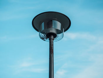 Low angle view of street light against sky