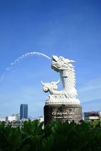 Statue of building against blue sky