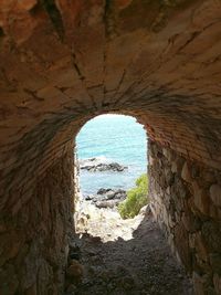 View of sea through cave