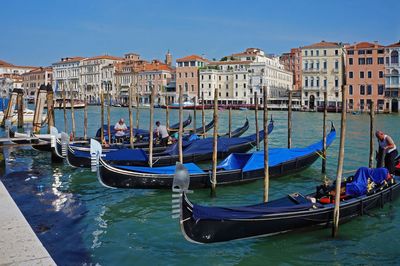 Boats moored in canal