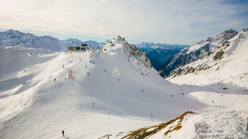 Scenic view of snowcapped mountains against sky