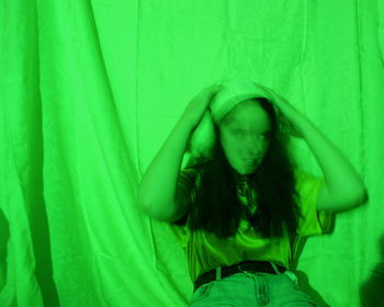 Close-up of green man on bed