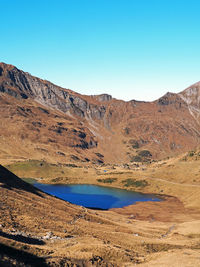 Pond amidst mountains