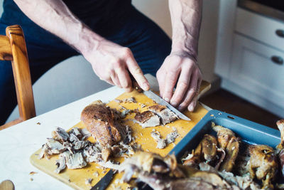 High angle view of person preparing food on table