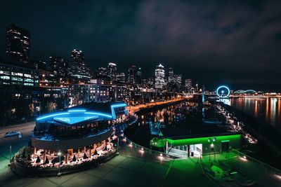 High angle view of illuminated cityscape at night