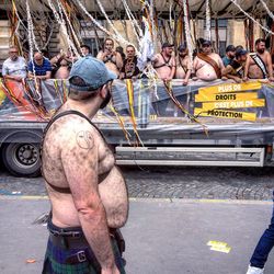 Rear view of people working on street