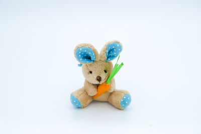 Close-up of stuffed toy against white background