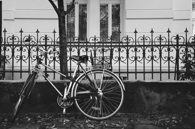 Bicycle leaning against railings in germany street.