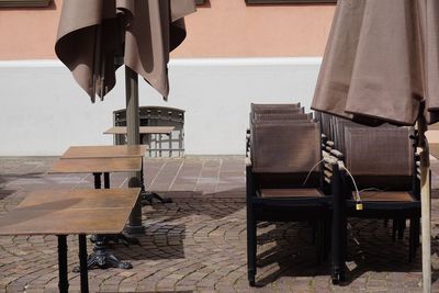 Empty chairs and tables in restaurant