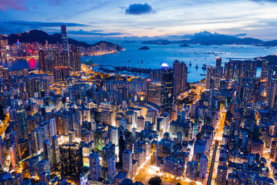 High angle view of illuminated city buildings at night