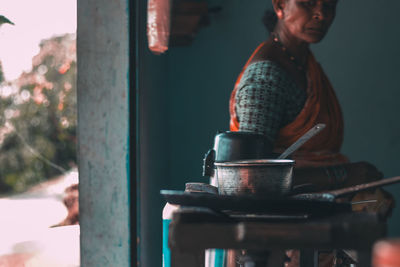 Close-up of man preparing food in kitchen