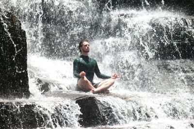 Portrait of young woman in water