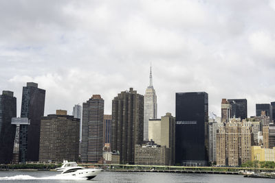 Skyscrapers in city against sky