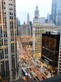 High angle view of traffic on road amidst buildings in city