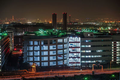 Illuminated buildings in city at night