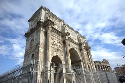 Low angle view of building against cloudy sky
