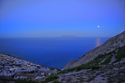 Scenic view of sea against clear blue sky