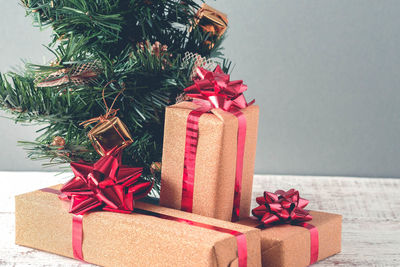 Close-up of christmas presents on wooden table