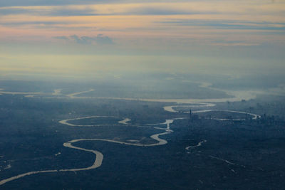 High angle view of city against sky during sunset