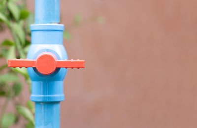 Close-up of pipe against wall