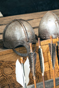 High angle view of viking helmets and arrows