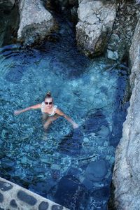 High angle view of woman swimming in sea