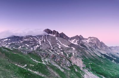 Scenic view of snowcapped mountains against clear sky