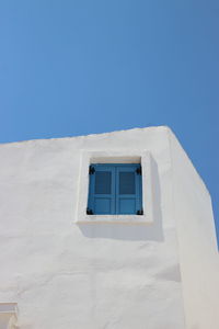 Low angle view of building against clear blue sky