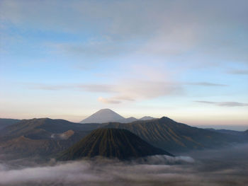 View of volcanic mountain against cloudy sky