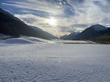 Scenic view of snowcapped mountains against sky