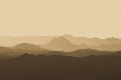 Scenic view of silhouette mountains against clear sky