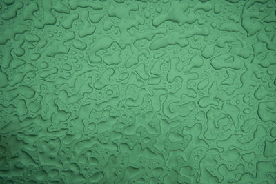 Full frame shot of raindrops on metal