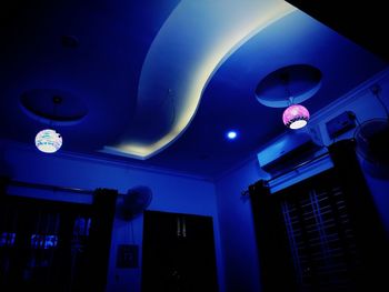 Low angle view of illuminated ceiling