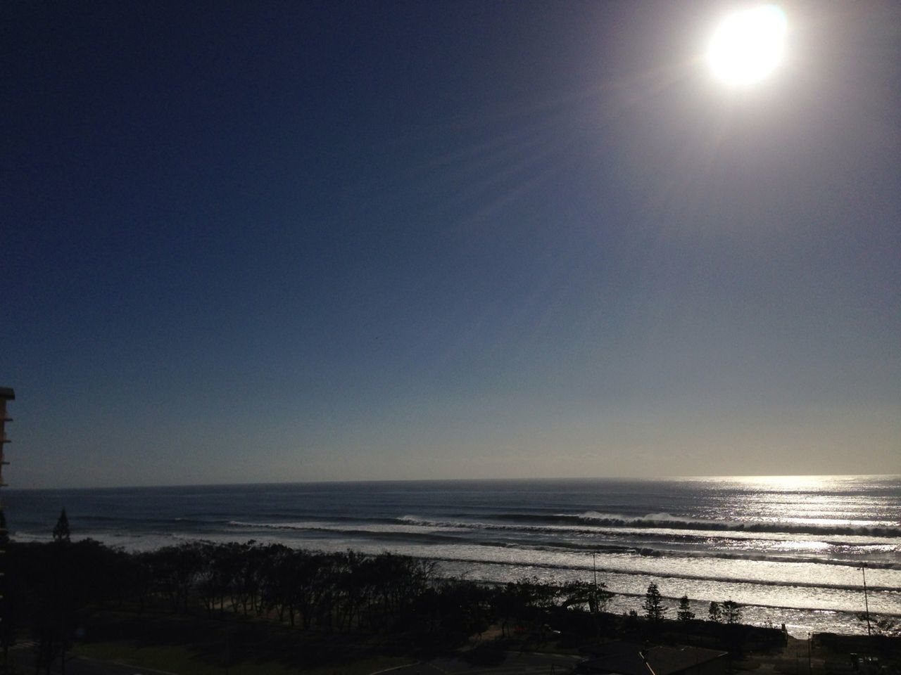 sea, horizon over water, water, clear sky, tranquil scene, scenics, tranquility, sun, beach, beauty in nature, copy space, nature, shore, idyllic, sunlight, sunbeam, sky, silhouette, remote, outdoors