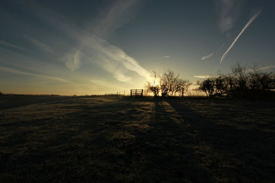 Scenic view of field against sky during sunset