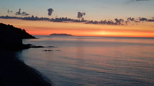 Scenic view of sea against sky during sunset