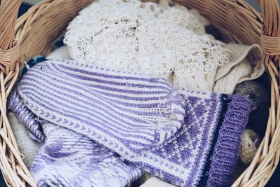 Close-up of warm clothing in wicker basket