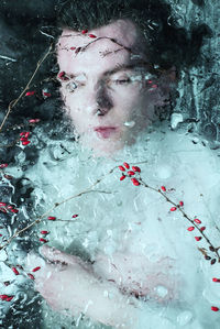 Close-up of man in frozen water