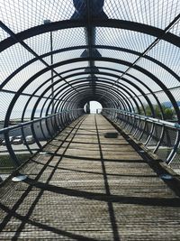 Low angle view of footbridge in tunnel