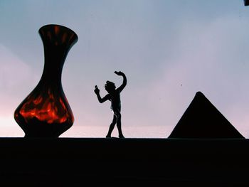 Low angle view of woman jumping