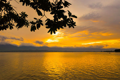 Scenic view of sea against orange sky