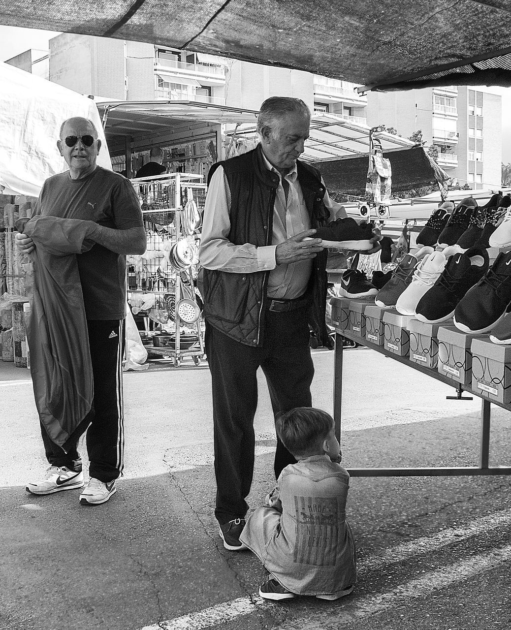 MEN ON MAN STANDING ON FLOOR