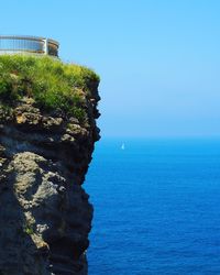 Scenic view of sea against clear blue sky