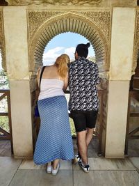 Couple looking at granada, in la alhambra.
